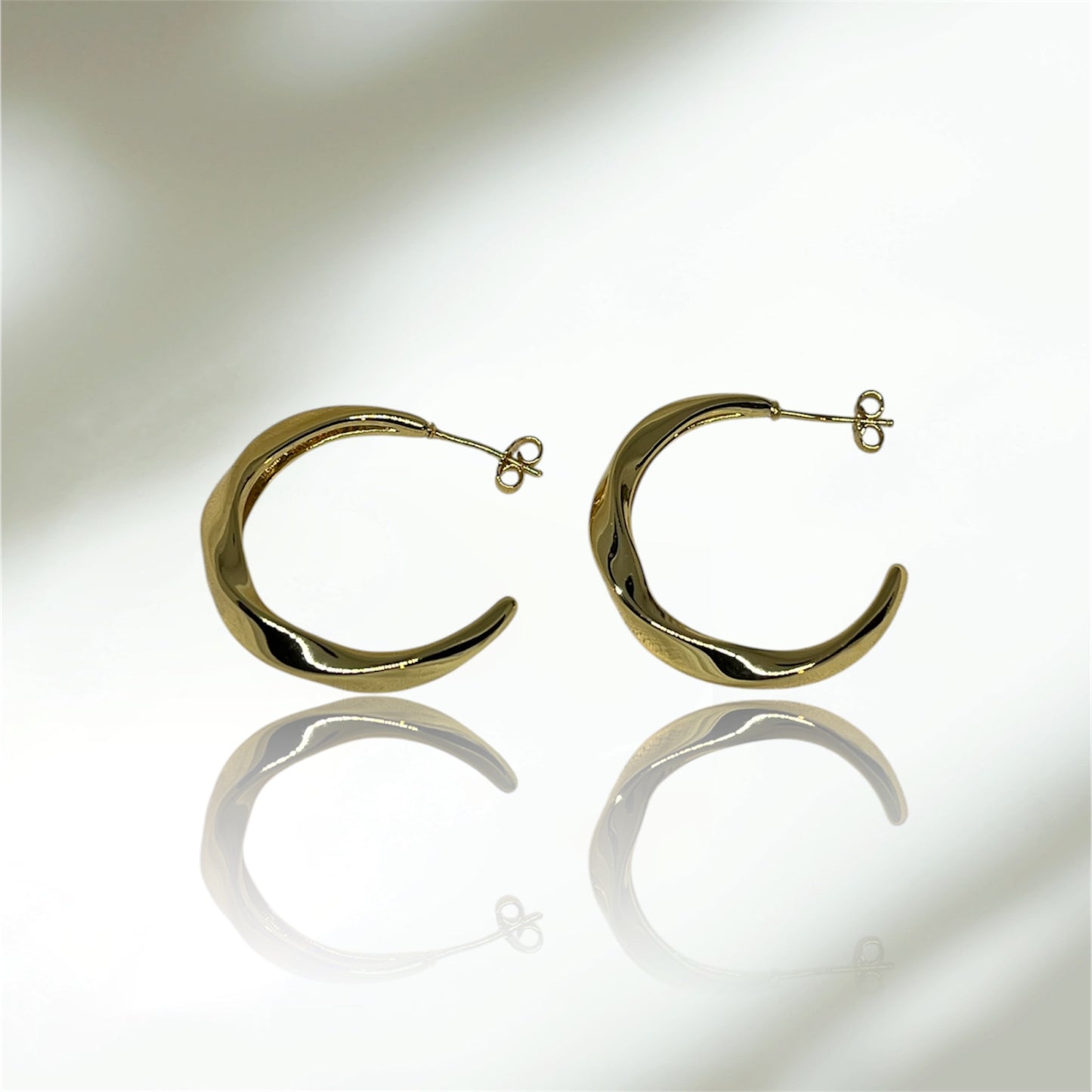 ARGOLLAS MEDIO ENROSCADAS 18K